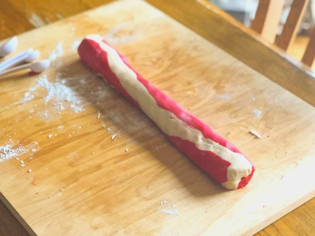 Red and white cookie dough rolled into one log