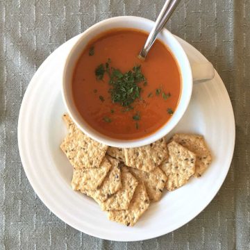 Allergy friendly tomato soup with crackers on the side