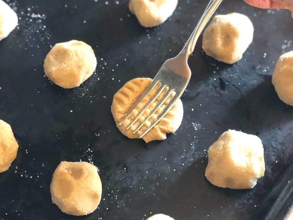 sunbutter cookies being pressed with a fork