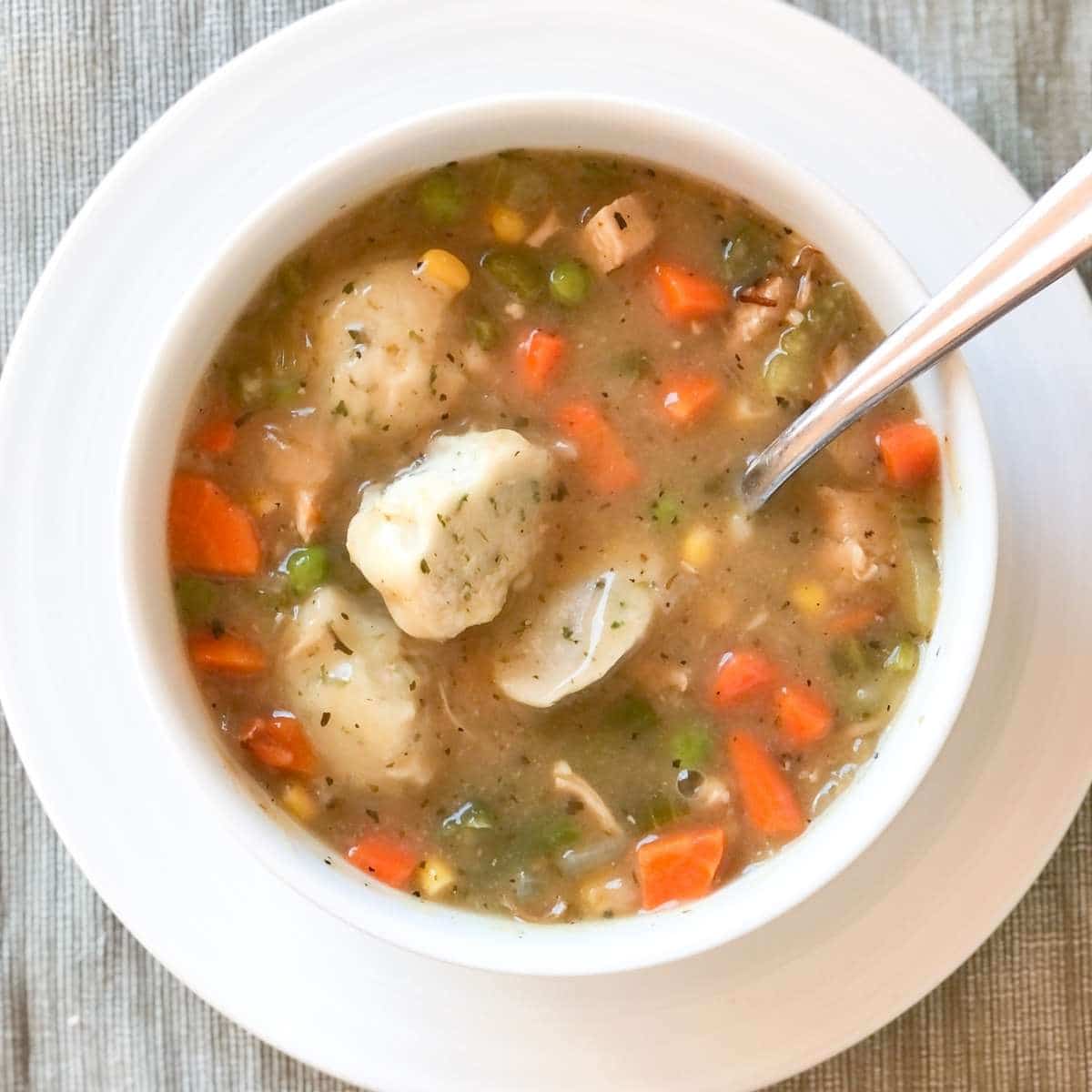A bowl of gluten free dairy free chicken and dumplings