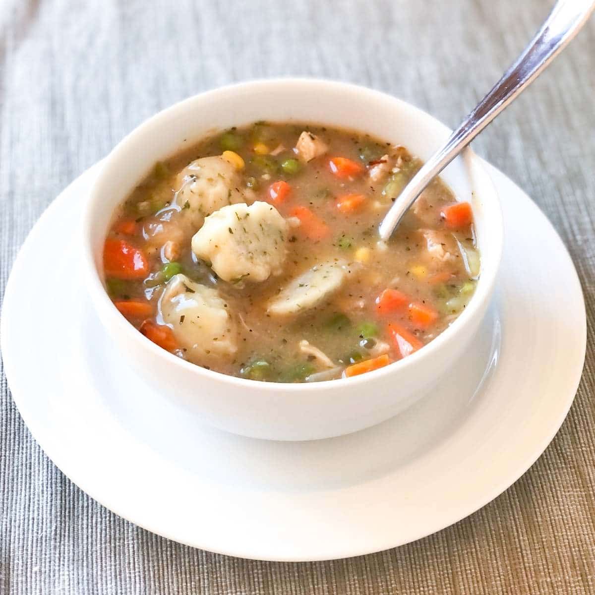 A bowl of gluten free dairy free chicken and dumplings stew