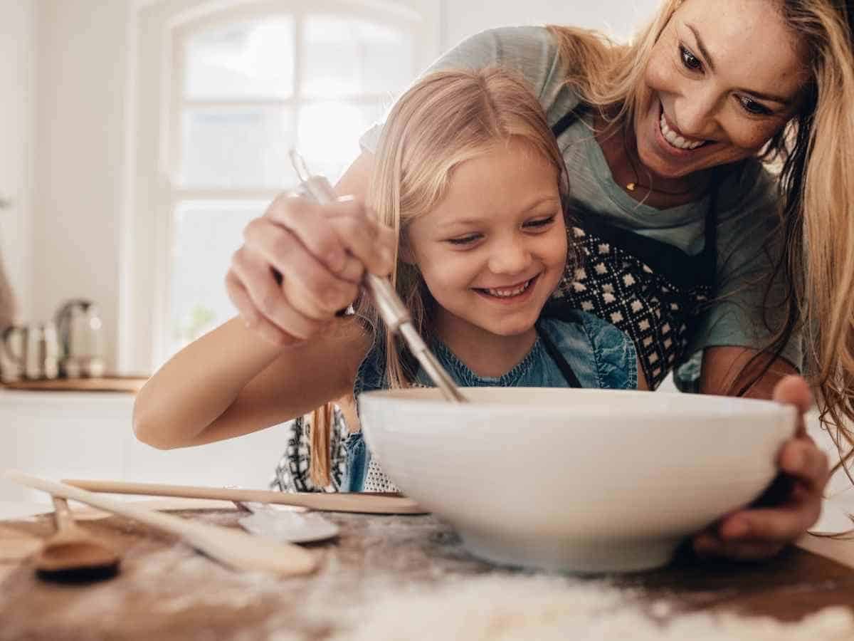 A mom and daughter cooking