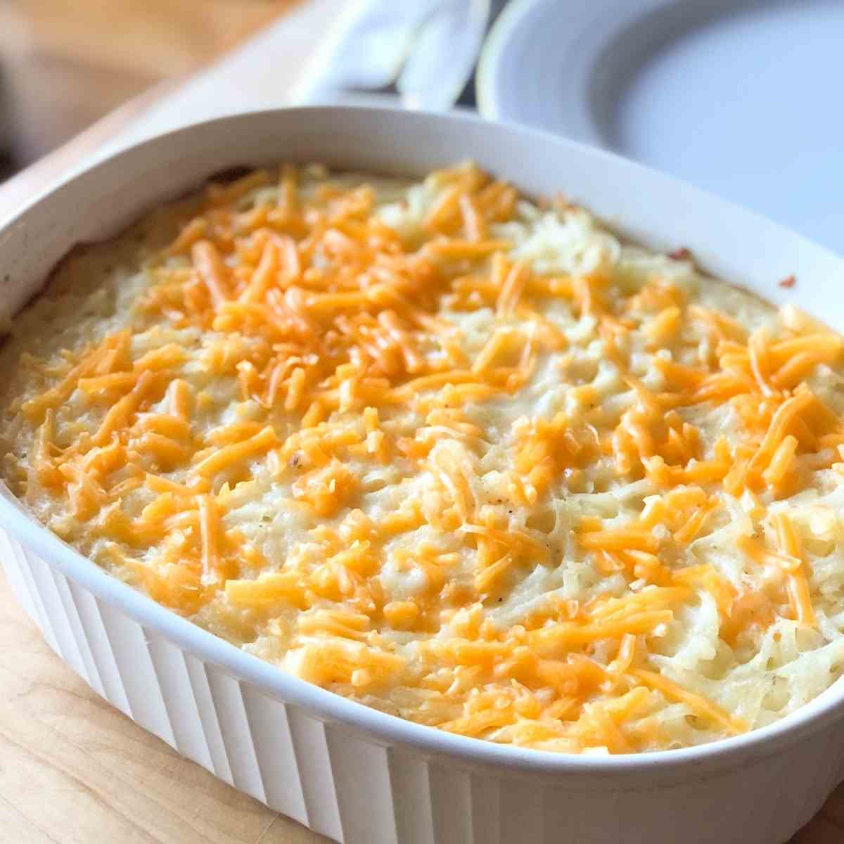 Dairy and gluten free cheesy potatoes in a casserole dish. 