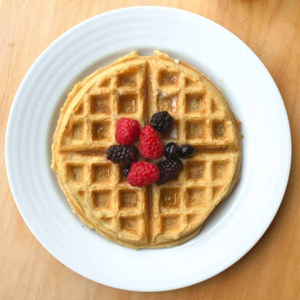 A waffle topped with berries