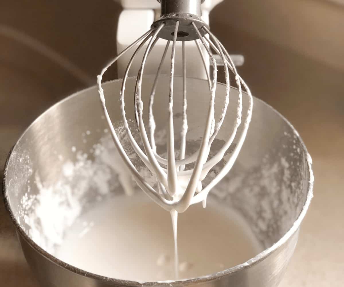 Royal icing on the wire beater of a mixer.