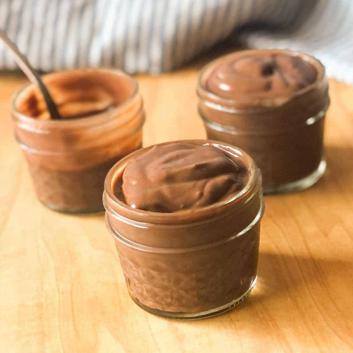 Chocolate oat milk pudding in half-pint jars