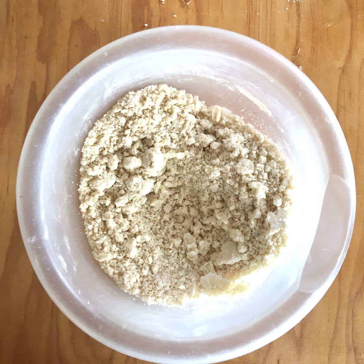 Gluten free flour and dairy free margarine mixed together forming coarse crumbs