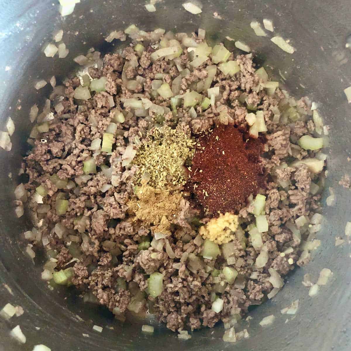 Spices added to ground beef for gluten free chili
