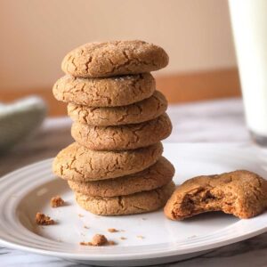 gluten free ginger cookies stacked on a plate