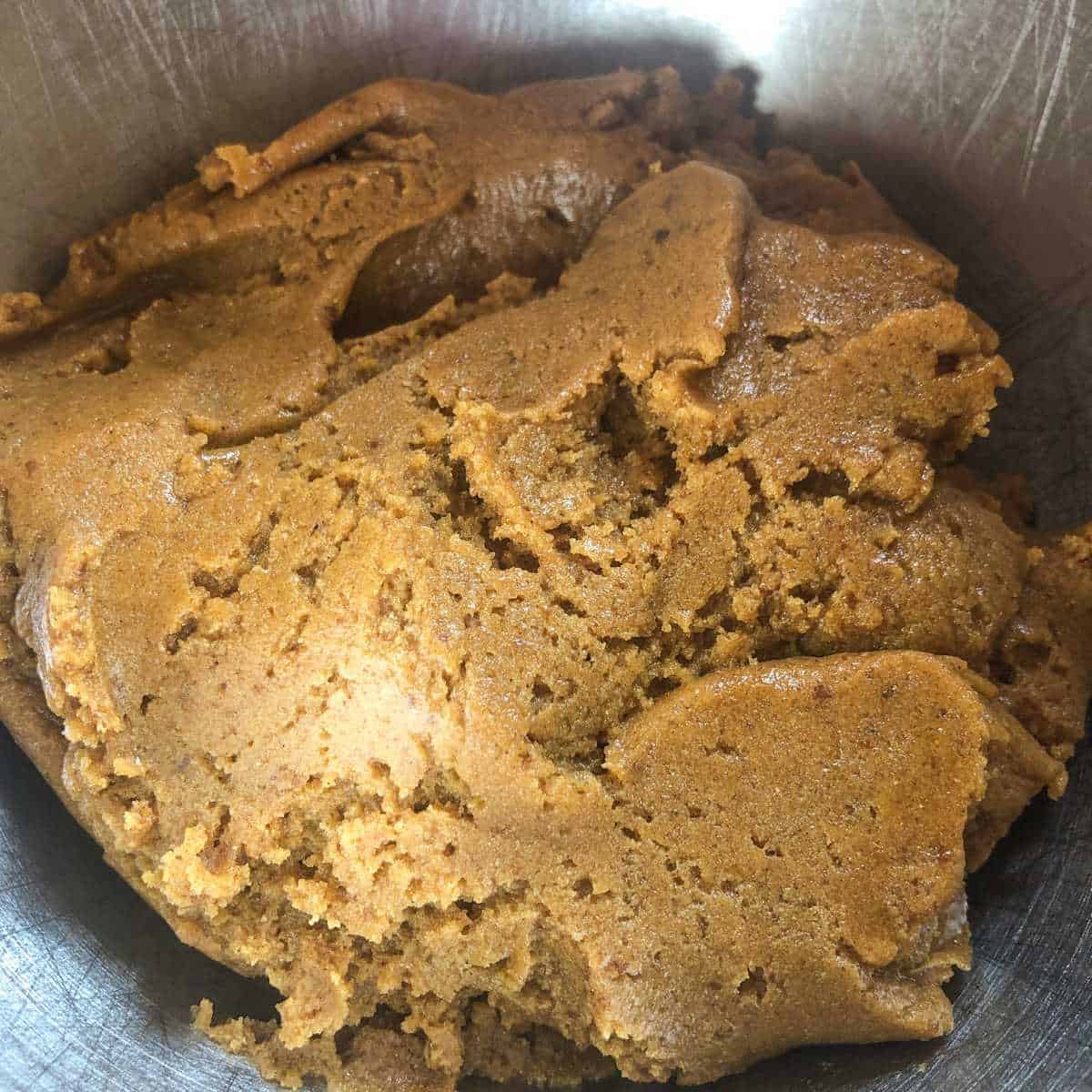 Gluten free ginger cookie dough in a large mixing bowl