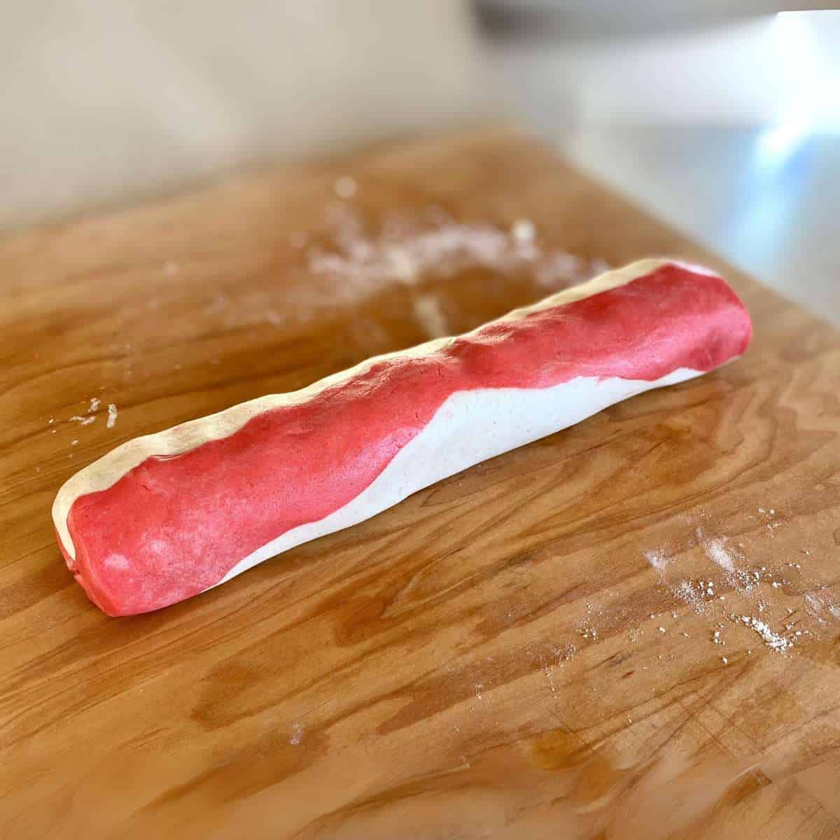 red and white cookie dough combined in one log