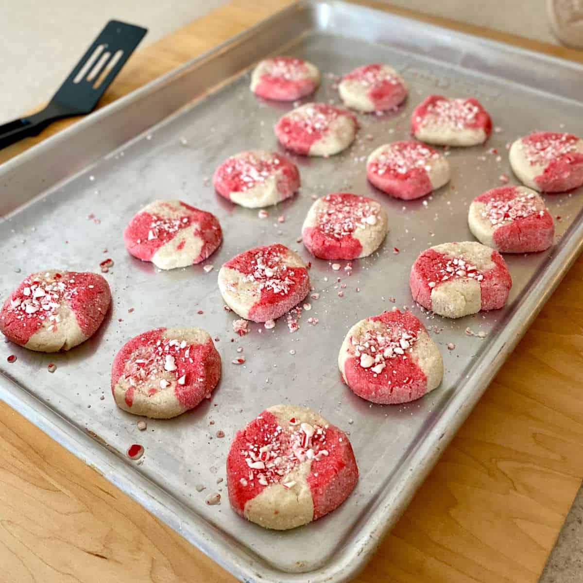 Gluten free candy cane cookies on a cookie sheet.