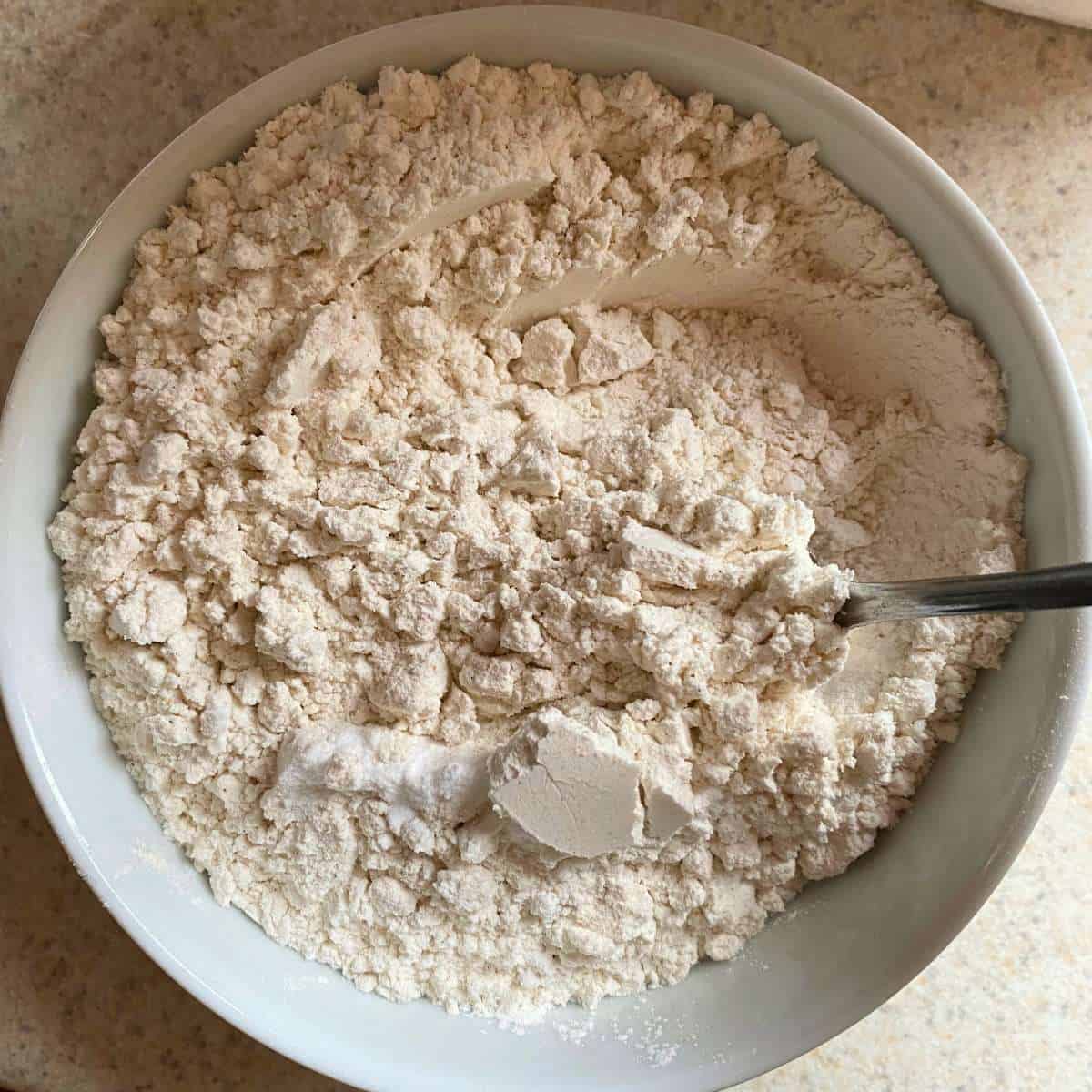 gluten free flour, baking soda, and salt mixed together in a bowl.